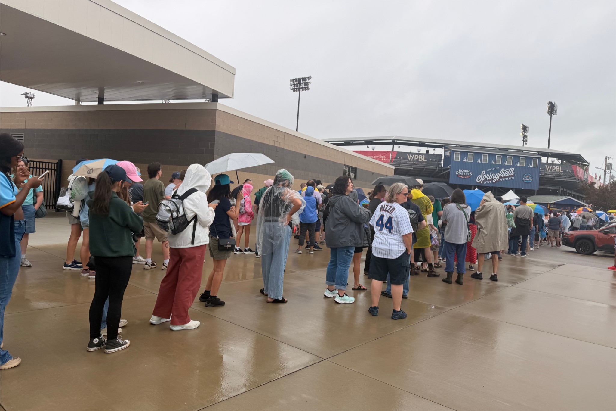 Fans wait outside Robin Roberts Stadium before gates open for the inaugural Women’s Professional Baseball League game in Springfield, Illinois, on Aug. 1, 2026.