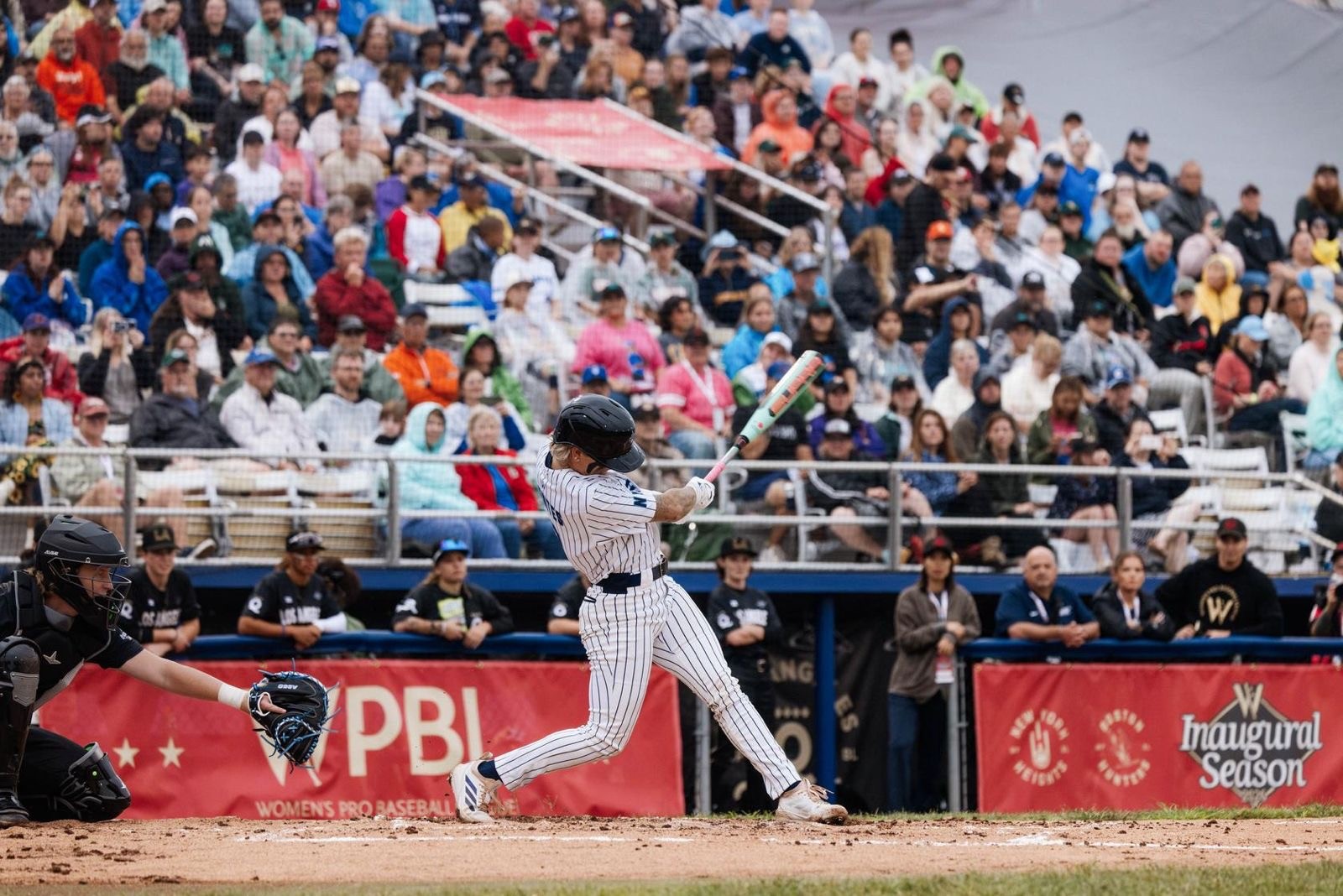 New York Heights infielder Denae Benites hits the first home run in Women’s Professional Baseball League history during the league’s inaugural game in Springfield, Illinois.